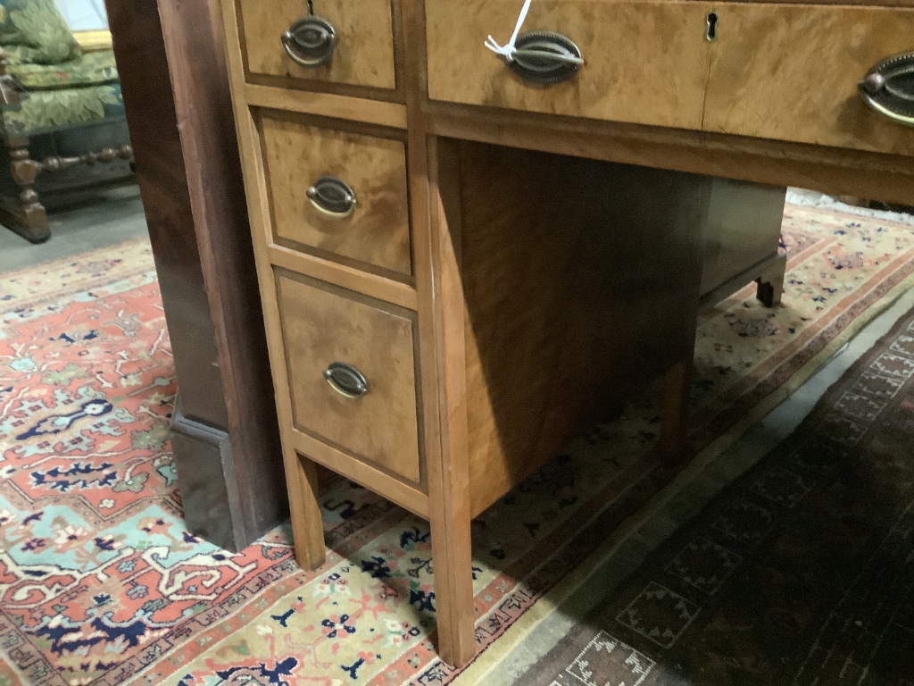 A mid 20th century Heals walnut kneehole desk, width 106cm depth 55cm height 78cm